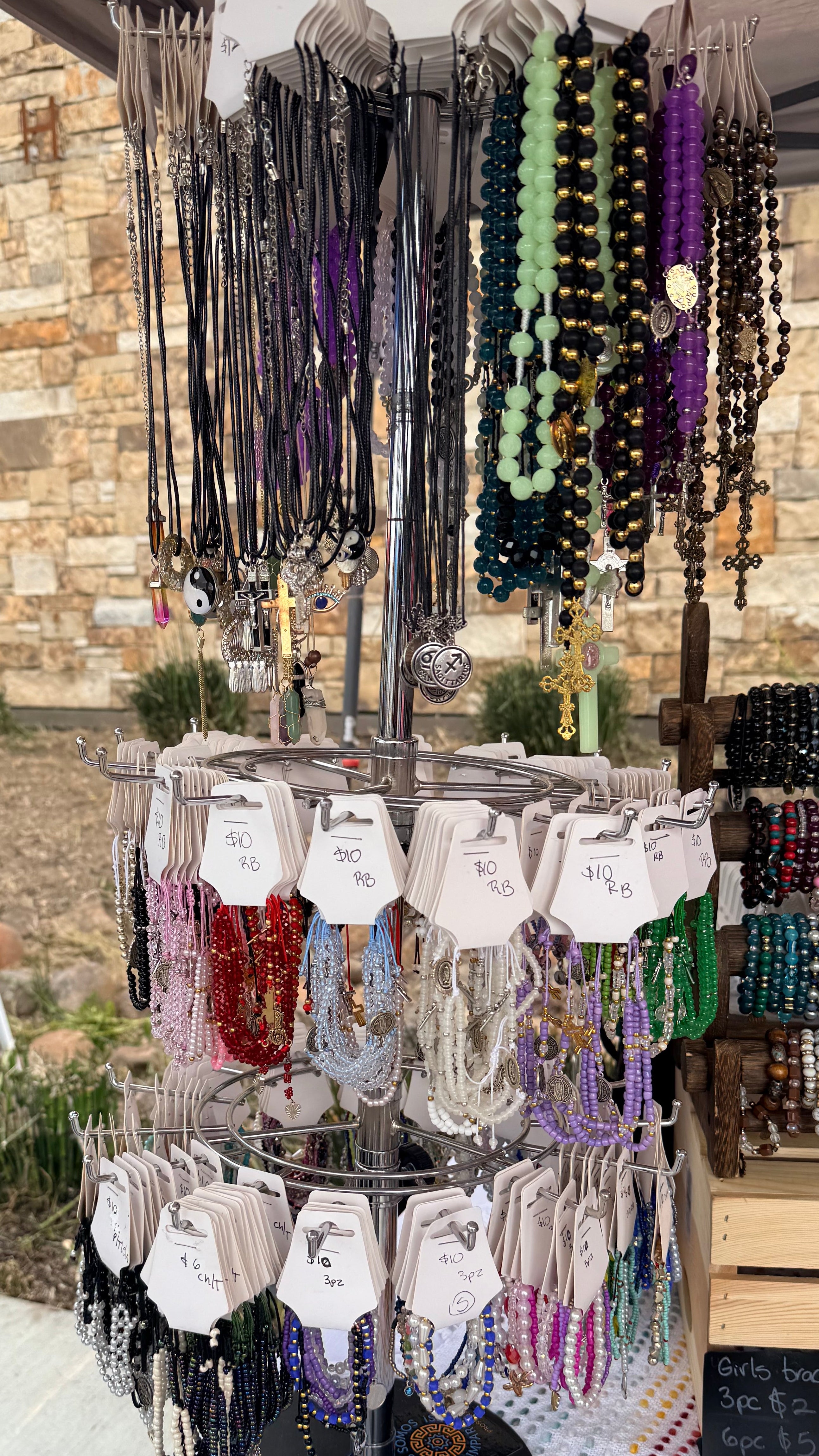 Display with:Rosaries, Rosaries bracelets, and set of three bracelets